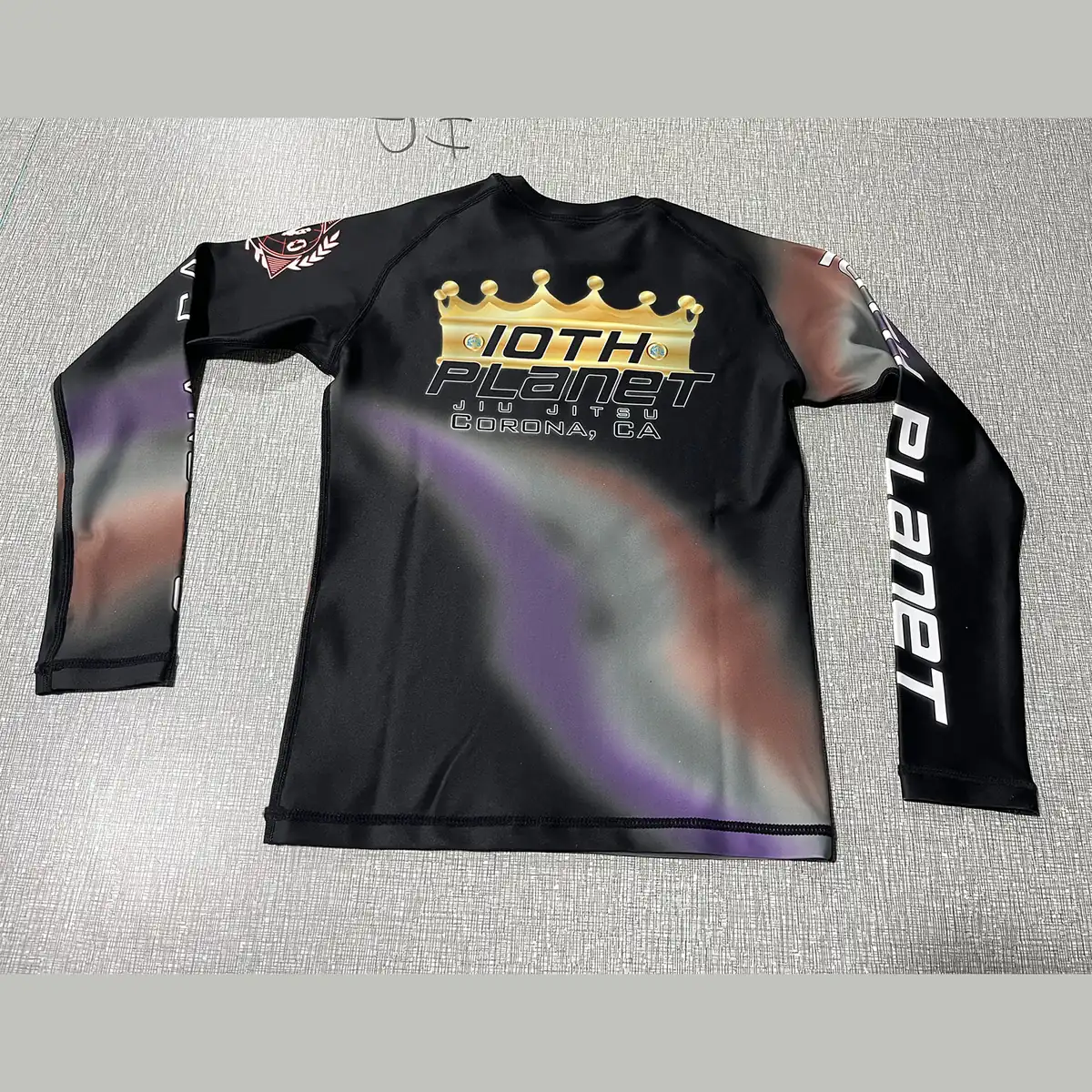 Custom team long sleeve rash guard with full sublimation print, front and back views