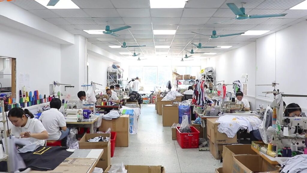 Garment production line with sewing operators at Glory Ground factory