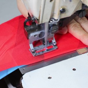 Close-up of stitching on a custom jersey showing sewn decoration detail