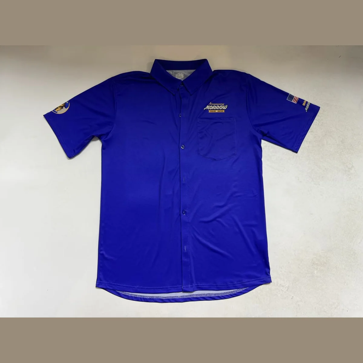 Custom royal blue performance button-up team shirt with chest pocket
